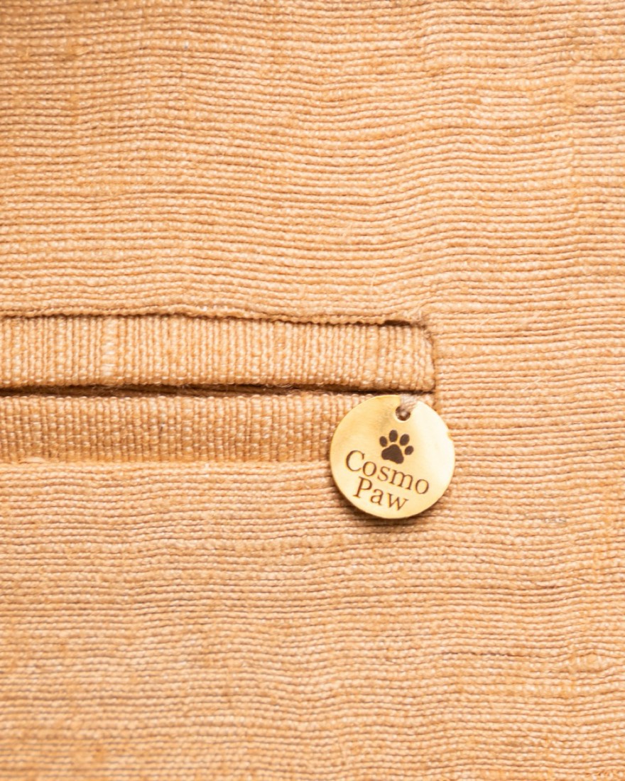 Coral — CosmoPaw logo tag on the pocket
