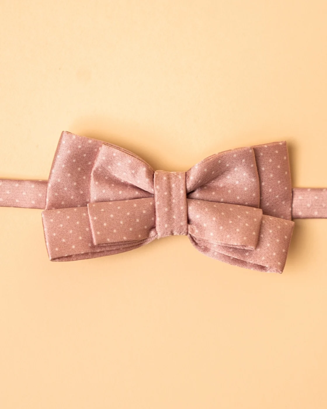The Poudre Bow — powder-pink silk with white polka dots