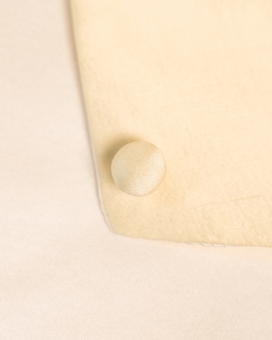 Sevilla — covered-button detail
