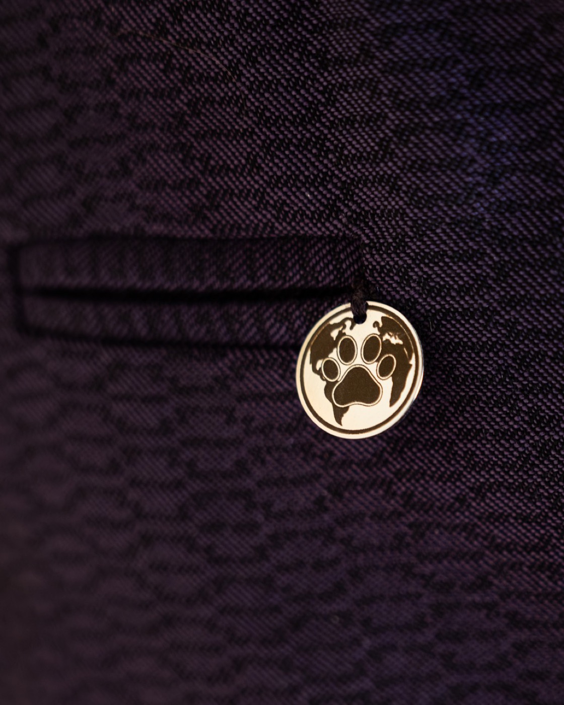 William — CosmoPaw logo tag by the pocket